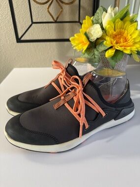 OluKai's Miki Li Black with Orange Laces sneakers